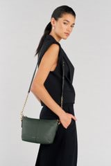 Profile view of model wearing the Oroton Lilly Zip Top Crossbody in Fern and Pebble leather for Women