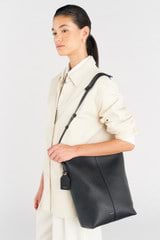 Profile view of model wearing the Oroton Lilly Hobo Bag in Black and Smooth leather for Women
