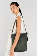 Profile view of model wearing the Oroton Lilly Hobo Bag in Fern and Pebble leather for Women