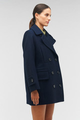 Profile view of model wearing the Oroton Double Breasted Pea Coat in North Sea and 50% wool, 50% polyester for Women