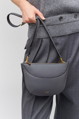 Profile view of model wearing the Oroton Florence Crossbody in Grey Flannel and Smooth leather for Women