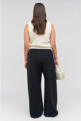 Profile view of model wearing the Oroton Contrast Waist Pant in Black and 53% poly, 42% wool, 5% elastane for Women