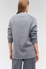 Profile view of model wearing the Oroton Button Detail Long Line Cardigan in Grey Marle and 100% wool for Women