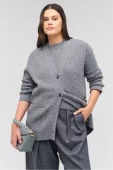 Profile view of model wearing the Oroton Button Detail Long Line Cardigan in Grey Marle and 100% wool for Women