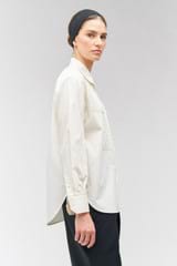 Profile view of model wearing the Oroton Doilie Detail Overshirt in Cream and 100% cotton for Women