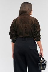 Profile view of model wearing the Oroton Doilie Detail Overshirt in Bitter Choc and 100% cotton for Women