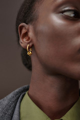 Profile view of model wearing the Oroton Julie Knot Hoops in 18K Gold Vermeil and Sustainably sourced 925 Sterling Silver for Women