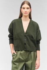 Profile view of model wearing the Oroton Long Sleeve Boxy Cardigan in Green Olive and 100% wool for Women