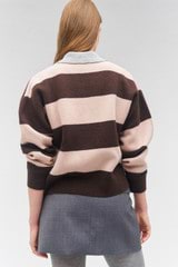 Profile view of model wearing the Oroton Stripe Rugby Knit in Bitter Choc and 100% wool for Women