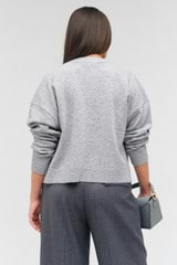 Profile view of model wearing the Oroton Long Sleeve Boxy Cardigan in Light Grey Marle and 100% wool for Women