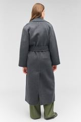 Profile view of model wearing the Oroton Long Line Coat in Charcoal and 100% wool for Women