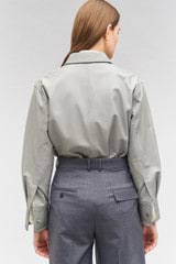 Profile view of model wearing the Oroton Leather Overshirt in Mist and 100% leather for Women