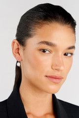 Profile view of model wearing the Oroton Kimberley Pearl Hook Earrings in Silver/Pearl and Brass for Women