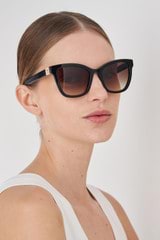 Profile view of model wearing the Oroton Frankie Sunglasses in Black and Acetate for Women