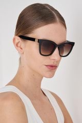Profile view of model wearing the Oroton Frankie Sunglasses in Black and Acetate for Women