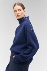 Profile view of model wearing the Oroton Button Detail Tunic in North Sea and 100% wool for Women