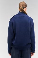 Profile view of model wearing the Oroton Button Detail Tunic in North Sea and 100% wool for Women