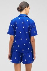 Profile view of model wearing the Oroton Embroidered Fruit Camp Shirt in Azure Blue and 100% cotton for Women