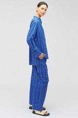 Profile view of model wearing the Oroton Swedish Stripe PJ Pant in Folk Blue and 100% cotton for Women