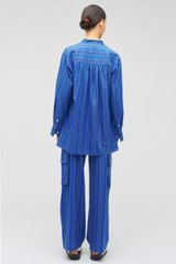 Profile view of model wearing the Oroton Swedish Stripe PJ Pant in Folk Blue and 100% cotton for Women