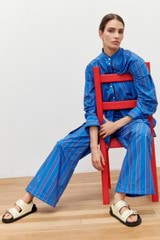 Profile view of model wearing the Oroton Swedish Stripe PJ Pant in Folk Blue and 100% cotton for Women