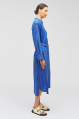 Profile view of model wearing the Oroton Swedish Stripe Shirt Dress in Folk Blue and 100% cotton for Women