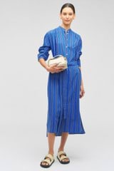Profile view of model wearing the Oroton Swedish Stripe Shirt Dress in Folk Blue and 100% cotton for Women