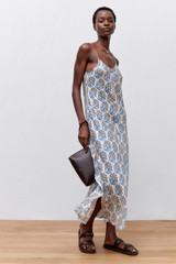 Profile view of model wearing the Oroton Zig Zag Flower Stamp Slip Dress in Folk Blue and 100% silk for Women