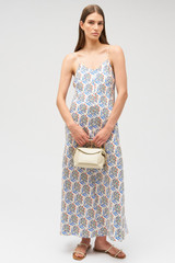 Profile view of model wearing the Oroton Zig Zag Flower Stamp Slip Dress in Folk Blue and 100% silk for Women