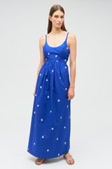 Profile view of model wearing the Oroton Embroidered Fruit Sundress in Azure Blue and 100% cotton for Women