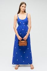 Profile view of model wearing the Oroton Embroidered Fruit Sundress in Azure Blue and 100% cotton for Women