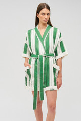 Profile view of model wearing the Oroton Deckchair Stripe Robe in Clover and 100% linen for Women