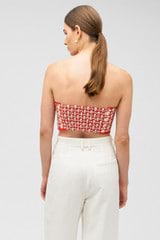 Profile view of model wearing the Oroton Apple Stamp Tie Top in Poppy and 100% cotton for Women