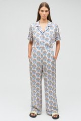 Profile view of model wearing the Oroton Zig Zag Flower Stamp PJ Pant in Folk Blue and 100% silk for Women