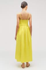 Profile view of model wearing the Oroton Lace Trim Sundress in Vibrant Yellow and 100% cotton for Women
