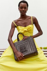 Profile view of model wearing the Oroton Lace Trim Sundress in Vibrant Yellow and 100% cotton for Women