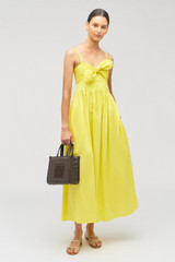 Profile view of model wearing the Oroton Lace Trim Sundress in Vibrant Yellow and 100% cotton for Women