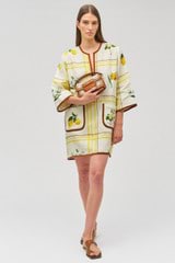 Profile view of model wearing the Oroton Summer Picnic Tunic Dress in Vibrant Yellow and 100% linen for Women