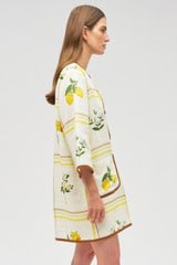 Profile view of model wearing the Oroton Summer Picnic Tunic Dress in Vibrant Yellow and 100% linen for Women