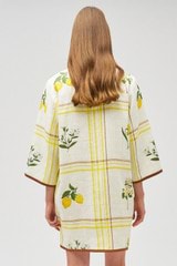 Profile view of model wearing the Oroton Summer Picnic Tunic Dress in Vibrant Yellow and 100% linen for Women