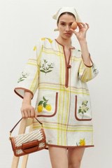 Profile view of model wearing the Oroton Summer Picnic Tunic Dress in Vibrant Yellow and 100% linen for Women