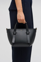 Profile view of model wearing the Oroton Ellis Small Tote in Black and Smooth leather for Women