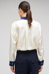 Profile view of model wearing the Oroton Celestial Print Shirt in Antique White and 100% SILK for Women