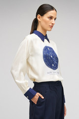 Profile view of model wearing the Oroton Celestial Print Shirt in Antique White and 100% SILK for Women