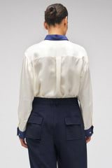 Profile view of model wearing the Oroton Celestial Print Shirt in Antique White and 100% SILK for Women