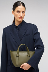 Profile view of model wearing the Oroton Ellis Small Tote in Pine Needle and Smooth leather for Women