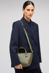 Profile view of model wearing the Oroton Ellis Small Tote in Pine Needle and Smooth leather for Women