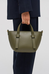 Profile view of model wearing the Oroton Ellis Small Tote in Pine Needle and Smooth leather for Women