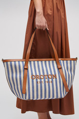 Profile view of model wearing the Oroton Ellis Canvas Medium Tote in Natural / Blue Stripe and Canvas for Women