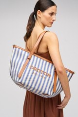 Profile view of model wearing the Oroton Ellis Canvas Medium Tote in Natural / Blue Stripe and Canvas for Women